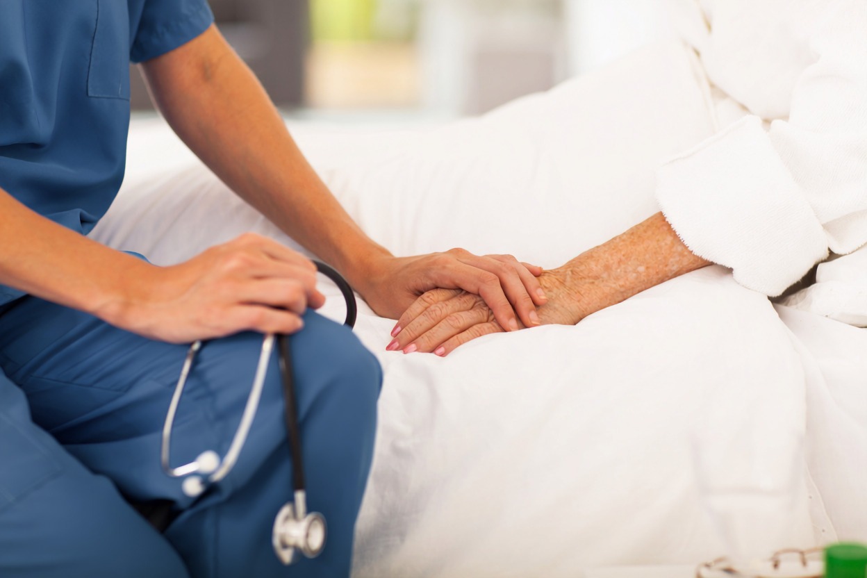 Healthcare professional assisting a resident in a residential treatment facility
